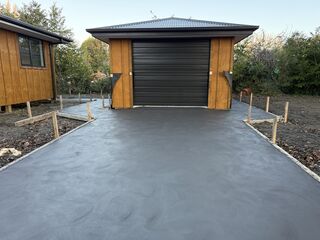 Driveway and footpath with a sponge finish texture on the top of the concrete..