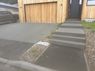 Exposed driveway and concrete step